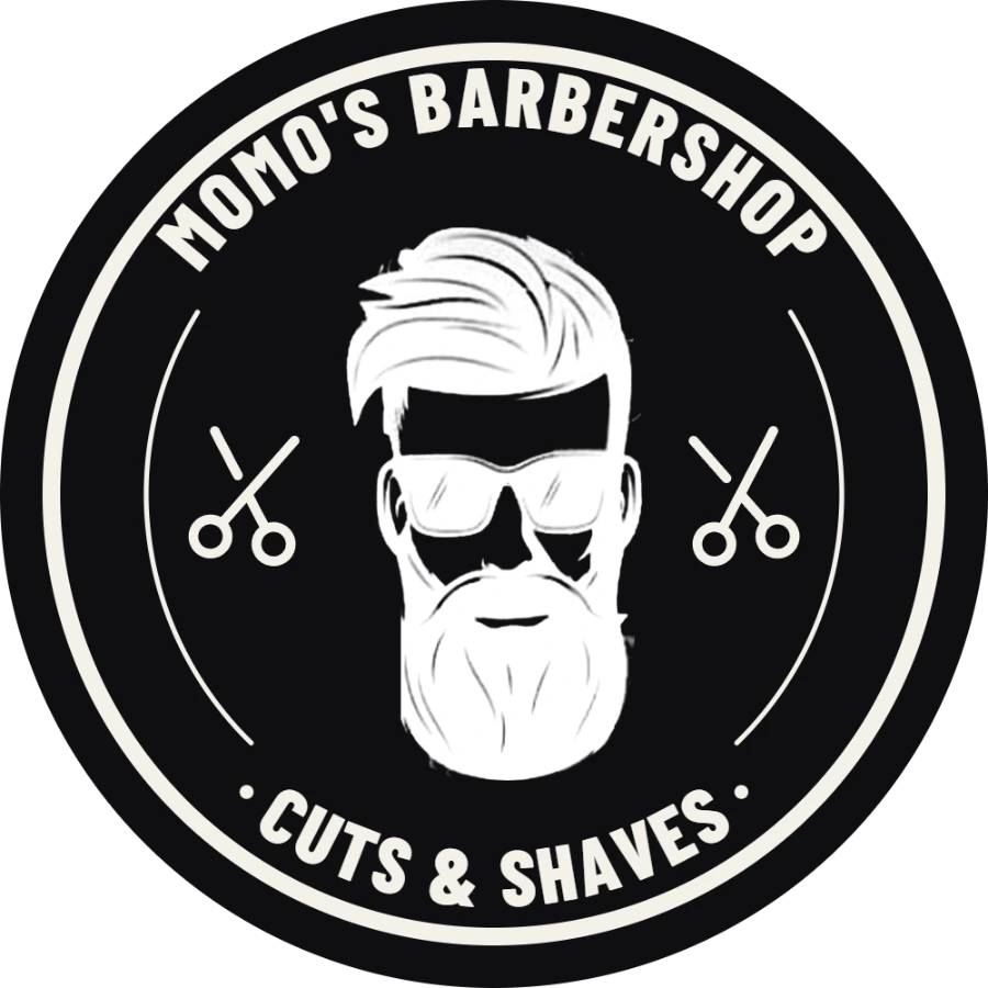 Logotipo de Momo's Barbershop: barbudo con gafas de sol entre dos tijeras, con Cuts & Shaves